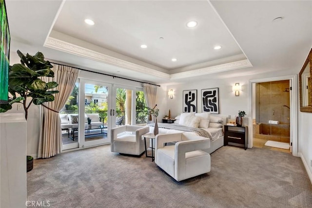 carpeted bedroom with french doors, ensuite bath, access to exterior, and a raised ceiling