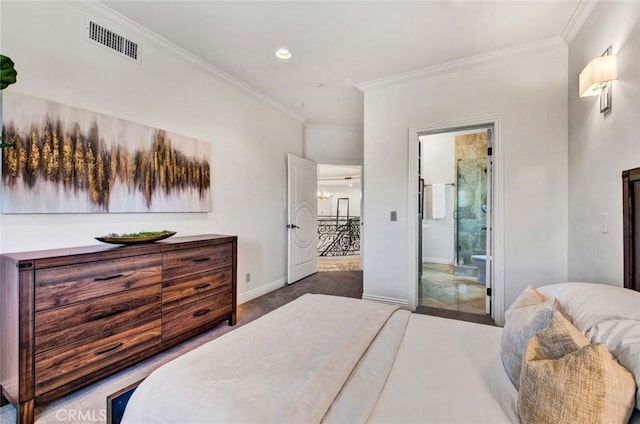 bedroom featuring crown molding and ensuite bathroom