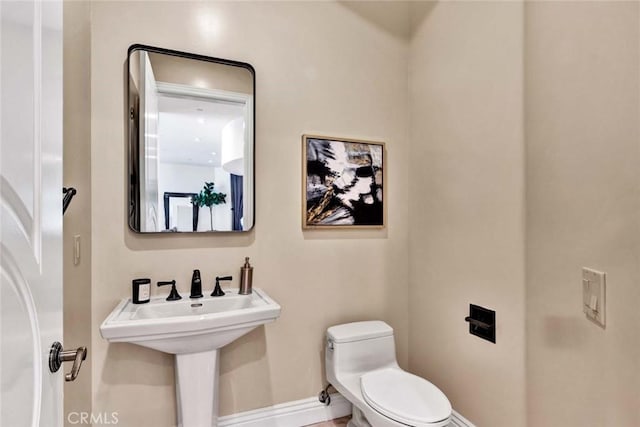 bathroom featuring toilet