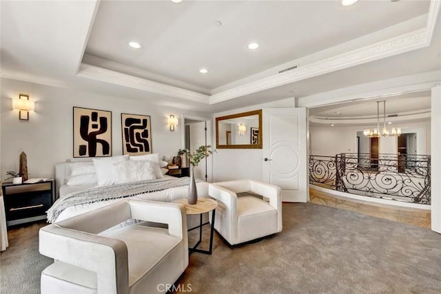 bedroom featuring an inviting chandelier, ornamental molding, a raised ceiling, and carpet flooring