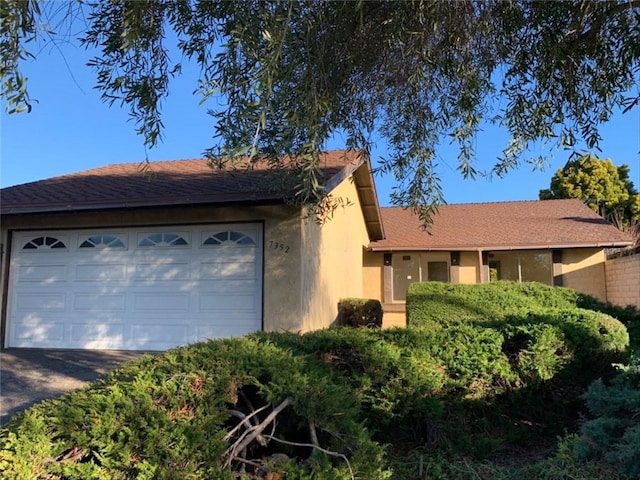 single story home featuring a garage