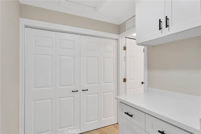 mudroom with hardwood / wood-style floors