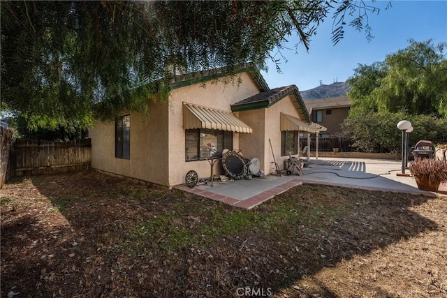 back of house with a patio area