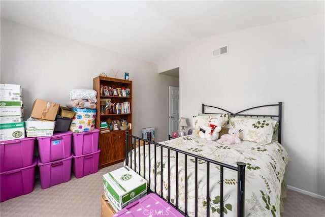 bedroom with vaulted ceiling and light colored carpet