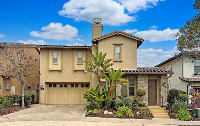 mediterranean / spanish-style home featuring a garage