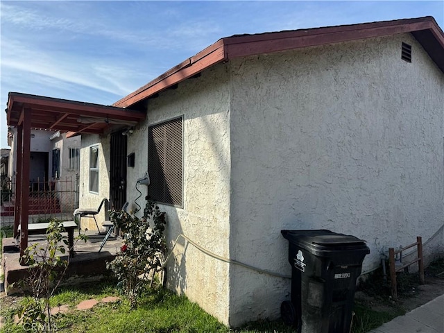 view of home's exterior with stucco siding