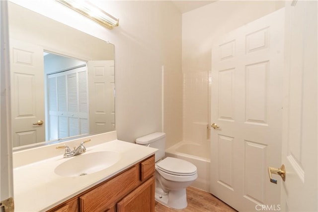 full bathroom with vanity, toilet, and washtub / shower combination