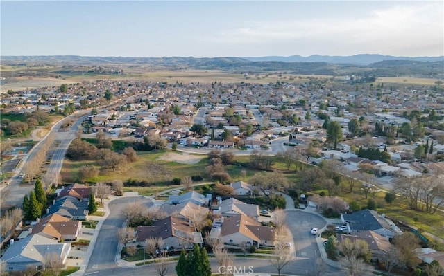 drone / aerial view featuring a mountain view