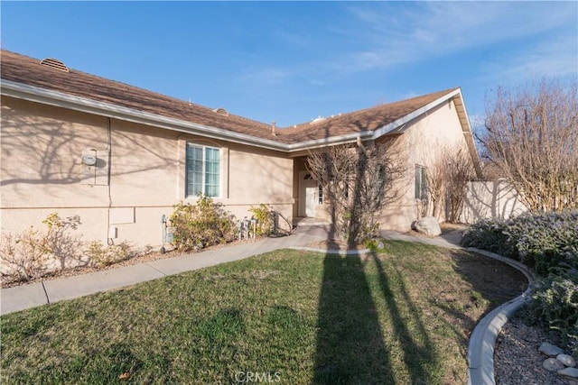 exterior space featuring a front lawn