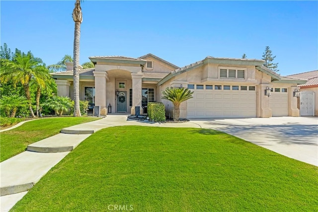 view of front of home featuring a garage and a front lawn