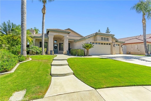 view of front of home with a garage and a front yard