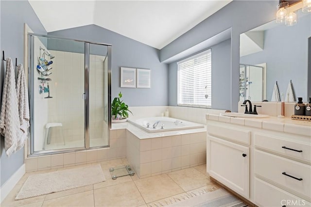 bathroom with vanity, shower with separate bathtub, tile patterned flooring, and vaulted ceiling