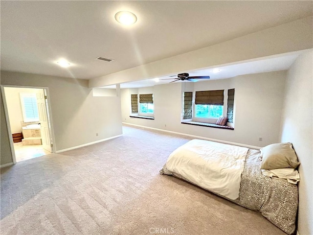 unfurnished bedroom featuring visible vents, baseboards, carpet, and ensuite bath