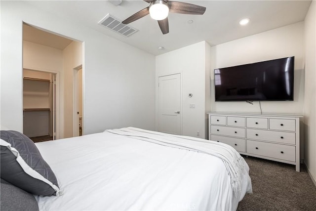 bedroom featuring dark colored carpet and ceiling fan