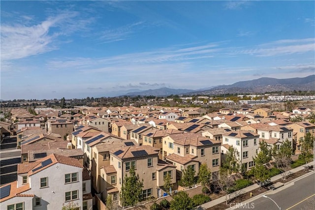 birds eye view of property featuring a mountain view