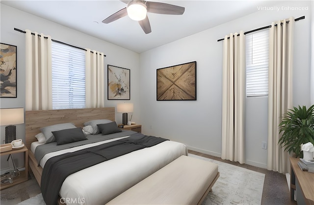 carpeted bedroom with ceiling fan