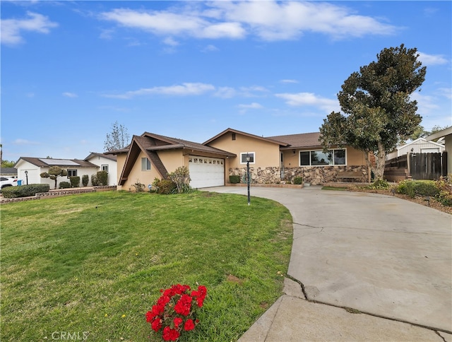 ranch-style house featuring a garage and a front lawn