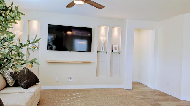 living room with ceiling fan and light wood-type flooring