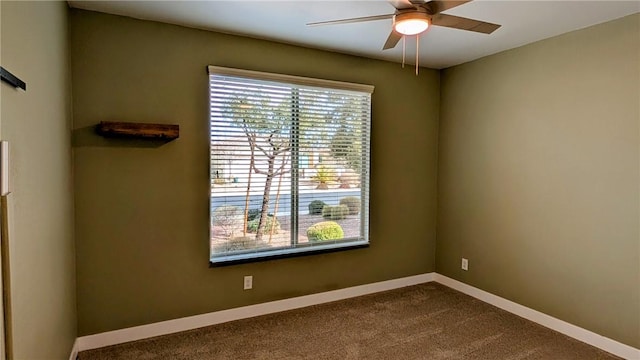 carpeted empty room featuring ceiling fan and a healthy amount of sunlight