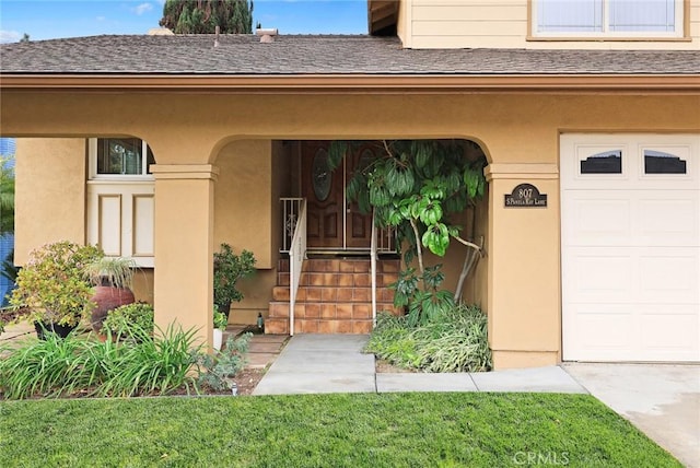 view of exterior entry featuring a garage