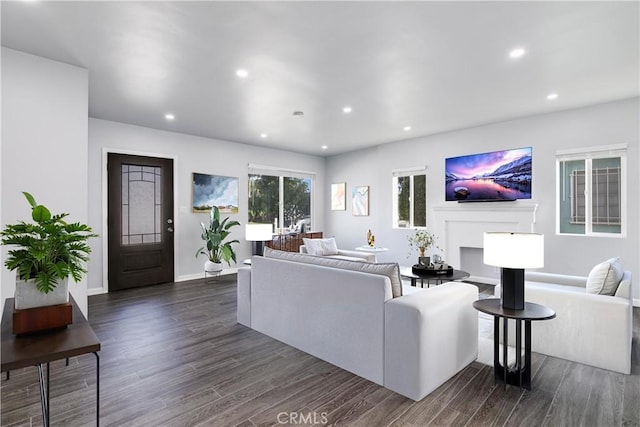 living area with recessed lighting, baseboards, and dark wood-style flooring