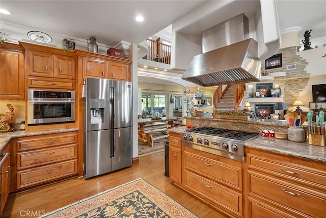 41700 Jojoba Hills Cir, Aguanga, CA 92536 - kitchen featuring light stone countertops, ventilation hood, stainless steel appliances, and light hardwood / wood-style floors