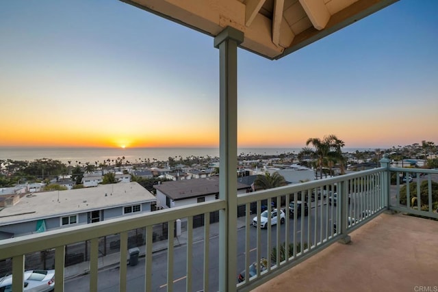 balcony at dusk with a water view