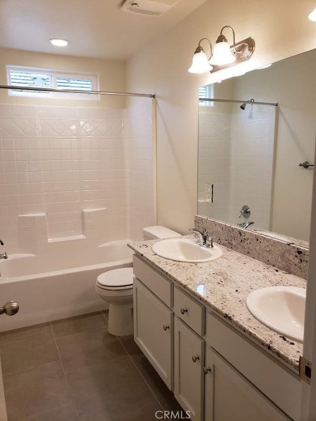 full bathroom featuring vanity, shower / tub combination, tile patterned floors, and toilet