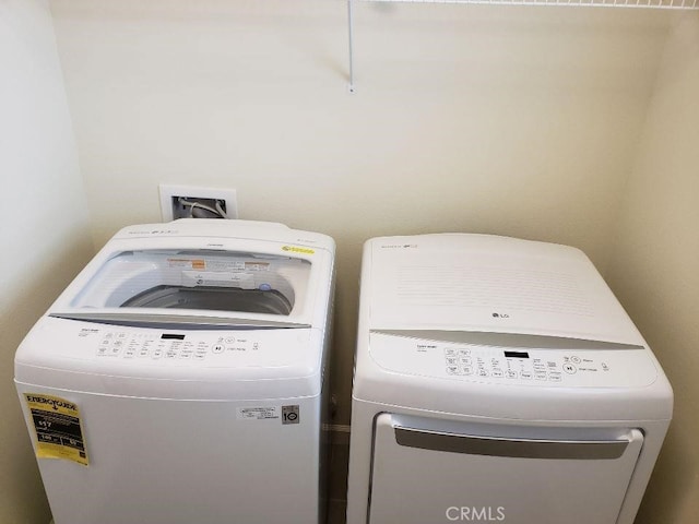 laundry room featuring separate washer and dryer