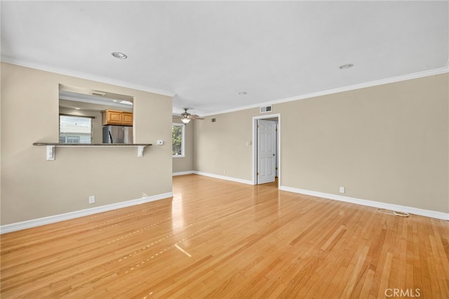 unfurnished living room with crown molding, light hardwood / wood-style floors, and ceiling fan