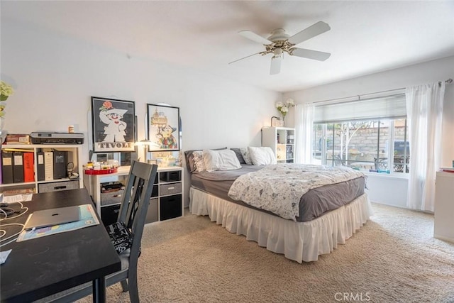 bedroom featuring ceiling fan and carpet