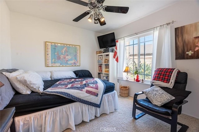 bedroom featuring light carpet and ceiling fan