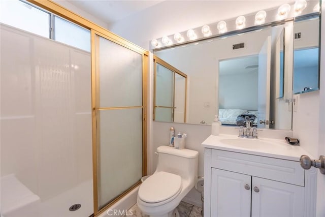 bathroom featuring walk in shower, vanity, and toilet