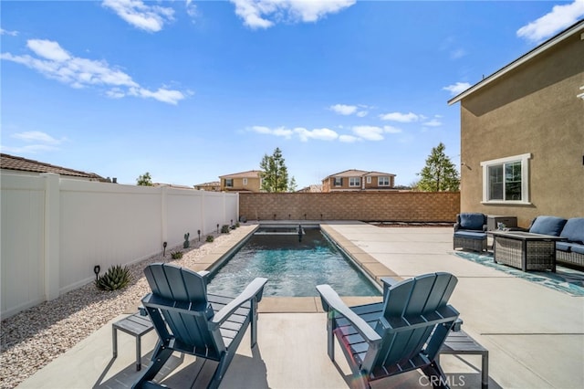 view of swimming pool featuring a patio, a fenced backyard, and a fenced in pool