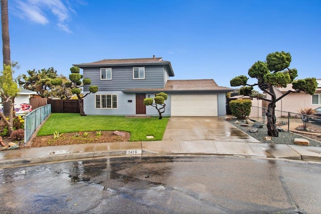 traditional-style home featuring fence, driveway, an attached garage, a shingled roof, and a front lawn