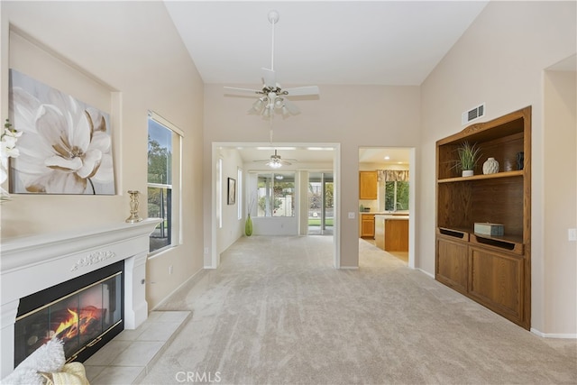 unfurnished living room featuring light carpet