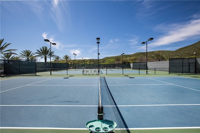 view of sport court with a mountain view