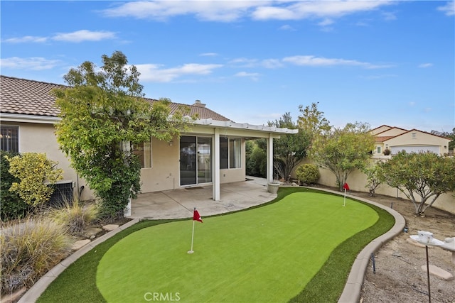 back of property with a patio