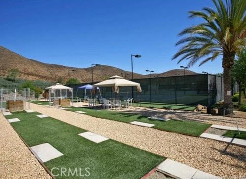 view of property's community with a gazebo and a mountain view