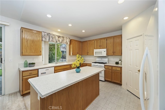 kitchen featuring white appliances and a kitchen island