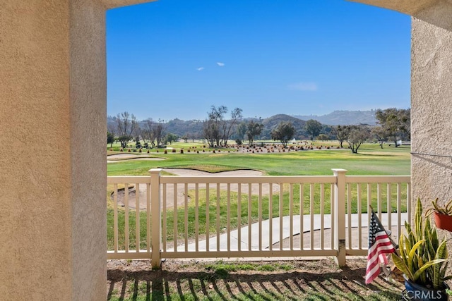 exterior space featuring golf course view and a mountain view