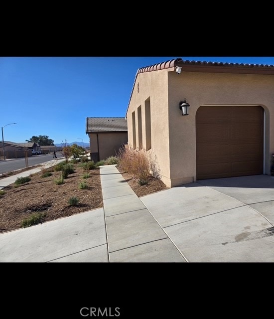 view of side of property featuring a garage