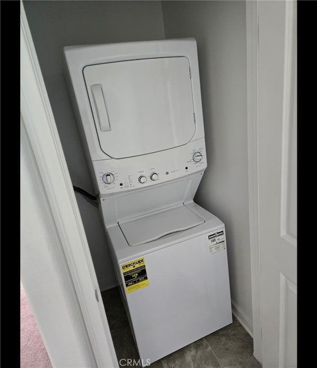 laundry area featuring stacked washer and clothes dryer