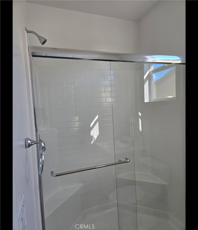 bathroom with an enclosed shower