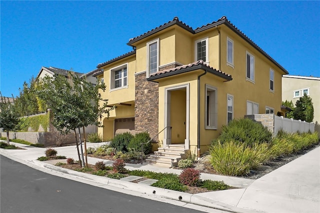 mediterranean / spanish-style house featuring a garage