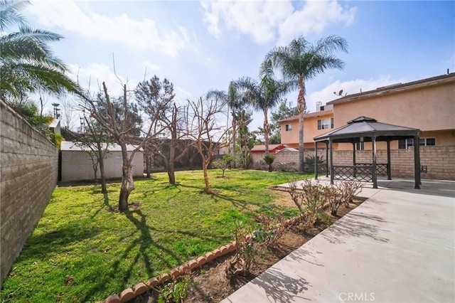 view of yard featuring a gazebo and a patio area