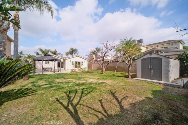 view of yard featuring a storage shed and a gazebo