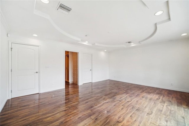 spare room featuring dark hardwood / wood-style floors