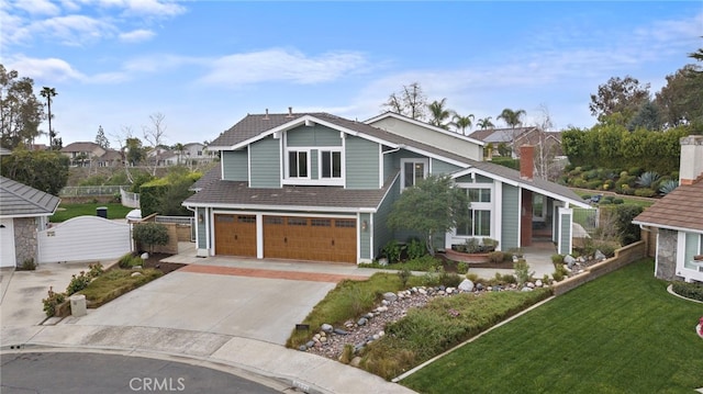 view of front of home featuring a garage and a front yard