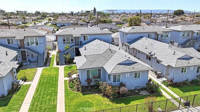 birds eye view of property with a residential view